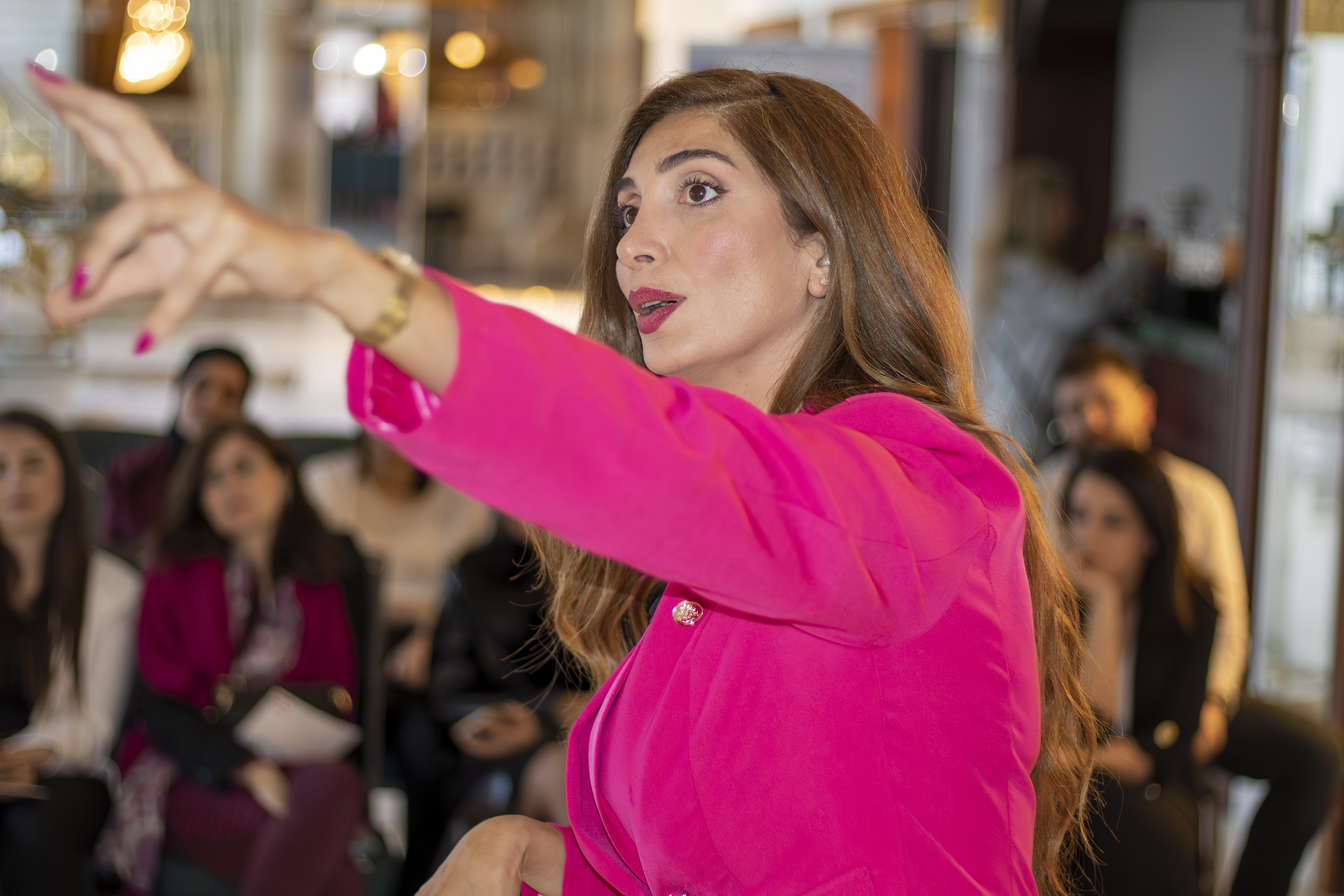 Dr. Joyce Azzam speaking on stage